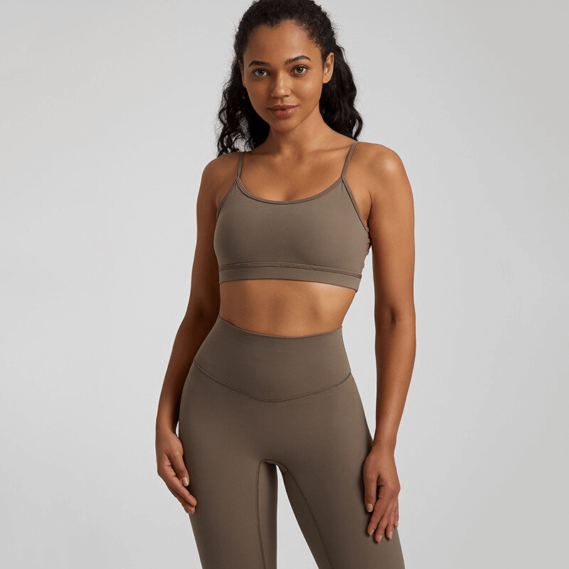 Female in solid color open back sports bra, showcasing activewear made of nylon and spandex, perfect for workouts. Product SF1488.